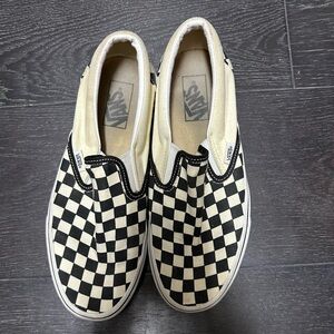VANS BLACK AND WHITE CHECKERED SLIP ONS